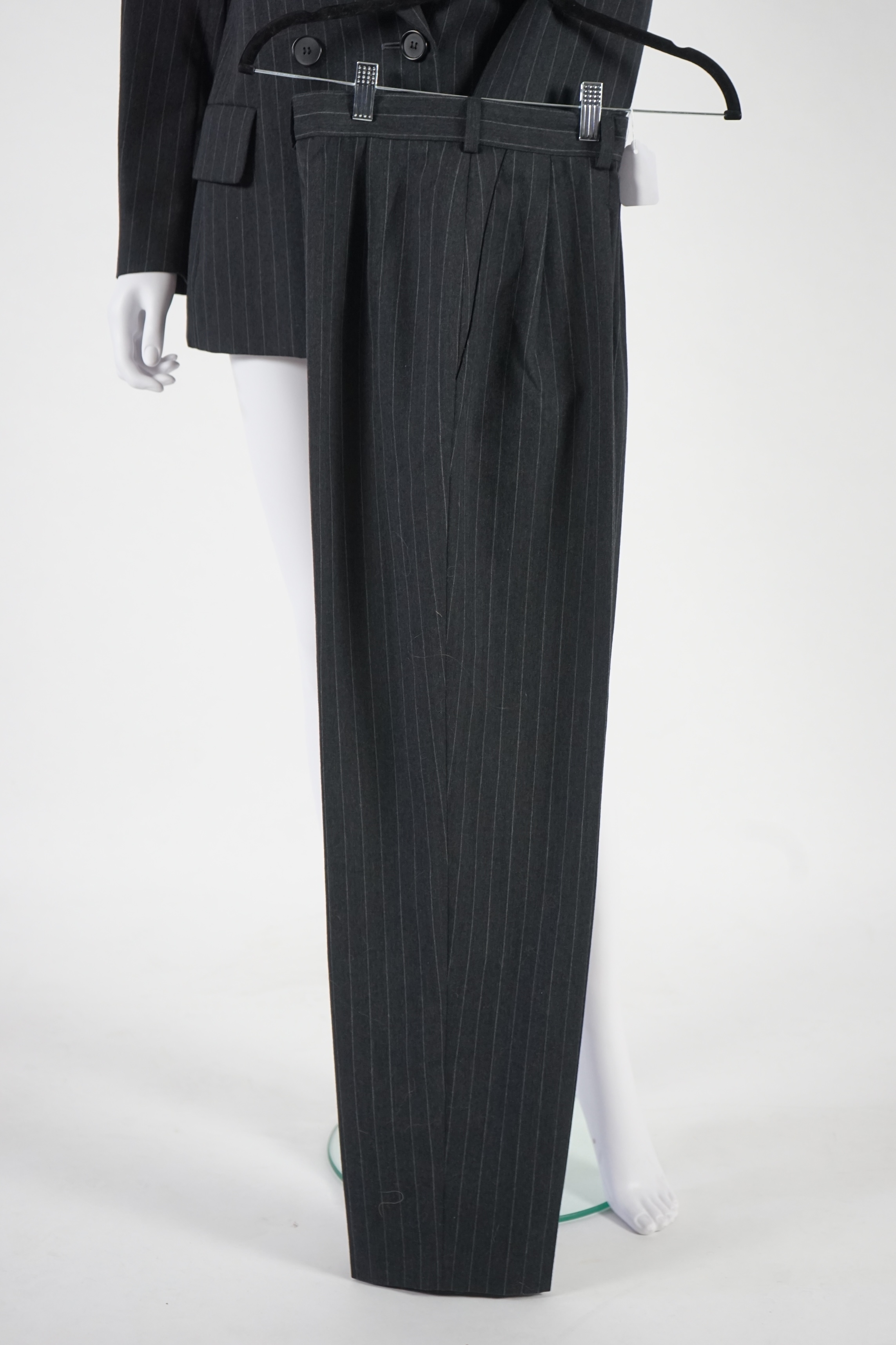 Two vintage Yves Saint Laurent variation lady's suits with both matching skirt and trousers, F 38 (UK 10). Please note alterations to make the waist smaller may have been carried out on some of the skirts. Proceeds to Ha